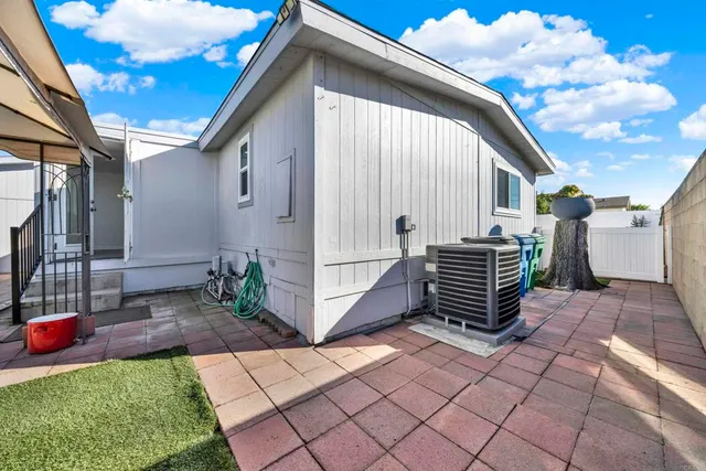a view of backyard with potted plants