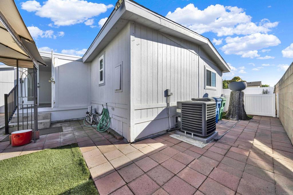 9255 North Magnolia Avenue, Unit SPC 158 Santee, CA 92071 - Photo 47 of 49 a backyard of a house with barbeque oven and next to a yard