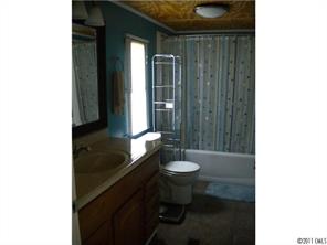 8052 Palm Tree Church Road Vale, NC 28168 - Photo 5 of 10 a bathroom with a granite countertop sink and a toilet