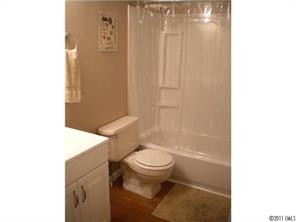 8052 Palm Tree Church Road Vale, NC 28168 - Photo 7 of 10 a white toilet sitting next to a bathroom sink