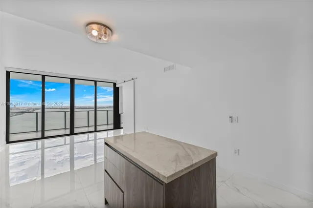 a kitchen with a sink and a window