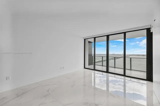 a view of an empty room with a large window