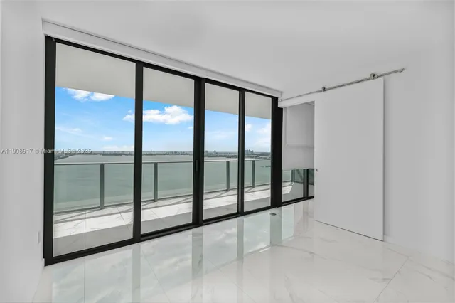 a view of an empty room and window