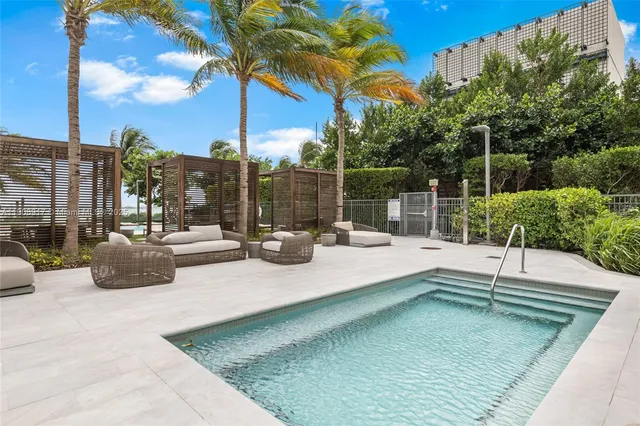 a view of swimming pool with outdoor seating
