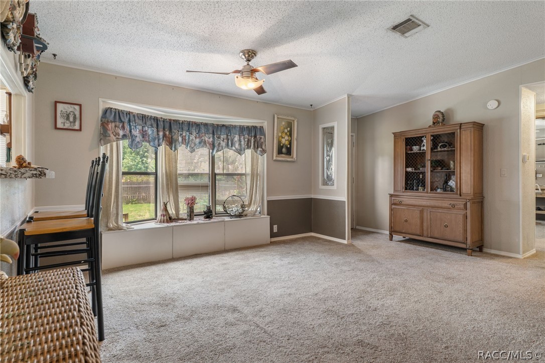 7927 West Cyprian Court Homosassa, FL 34448 - Photo 7 of 40 a living room with furniture and a window