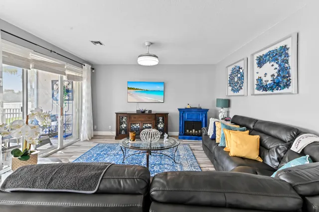 a living room with furniture and a rug
