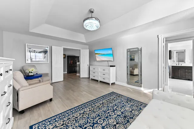 a white bath tub sitting next to a shower