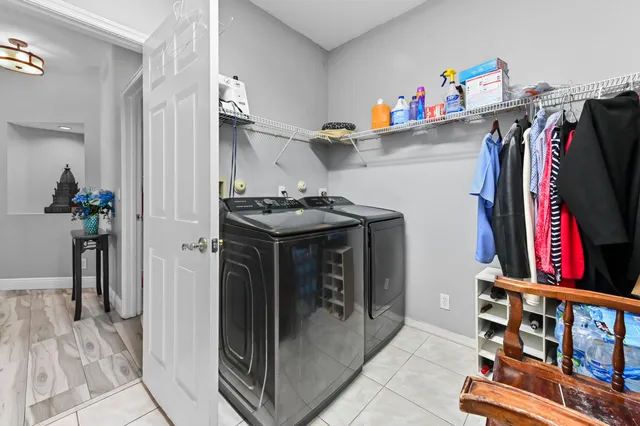 a view of a dinning table and chairs in patio of the house