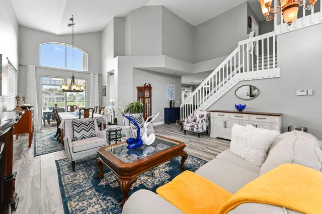 a living room with furniture and a clock