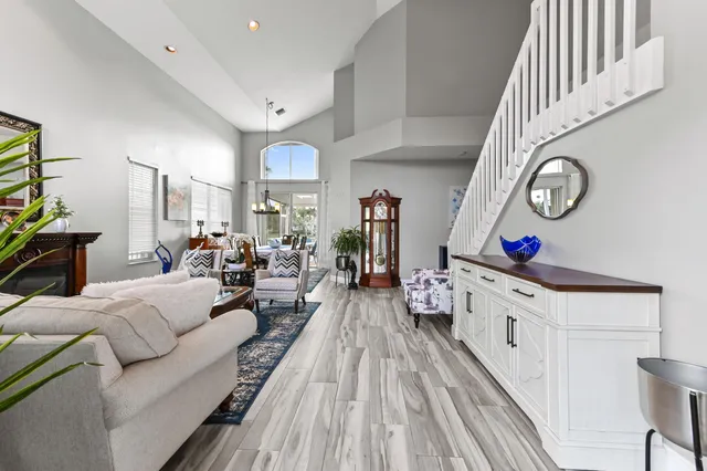 a view of a dining room with furniture and chandelier