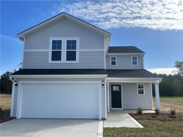 a front view of a house with garage
