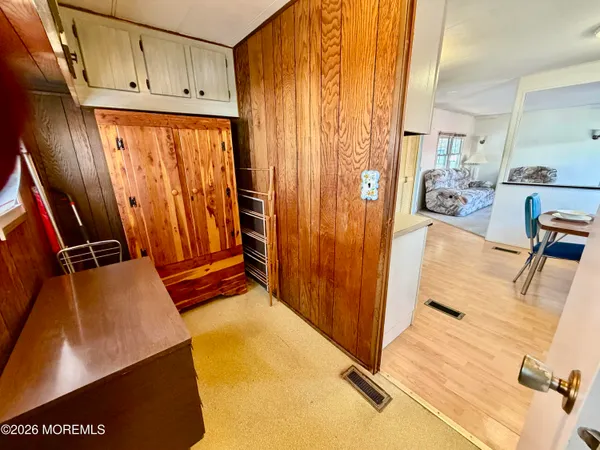 a view of a living room with bathroom