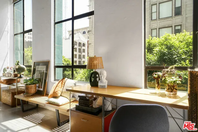 a kitchen with a sink and a large window