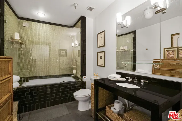 a bathroom with a sink double vanity and a mirror