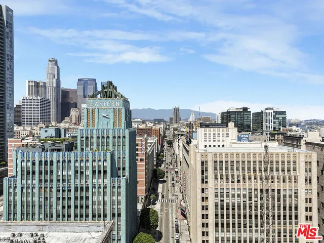 a view of city with tall buildings