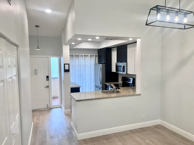 a bathroom with a sink a mirror and a shower