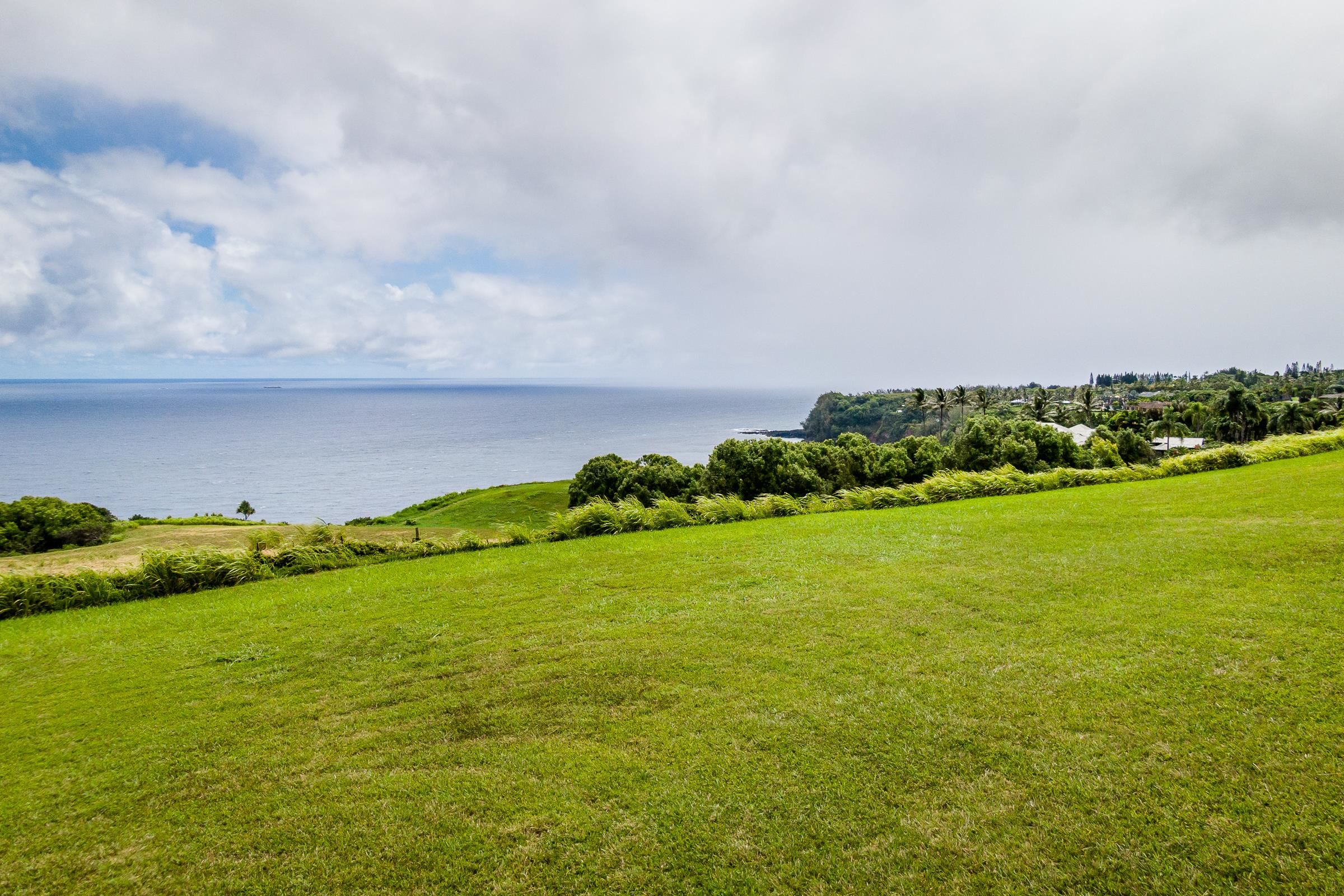 300 Mehana Road, Unit A Haiku, HI 96708 - Photo 16 of 21 a view of an ocean and beach