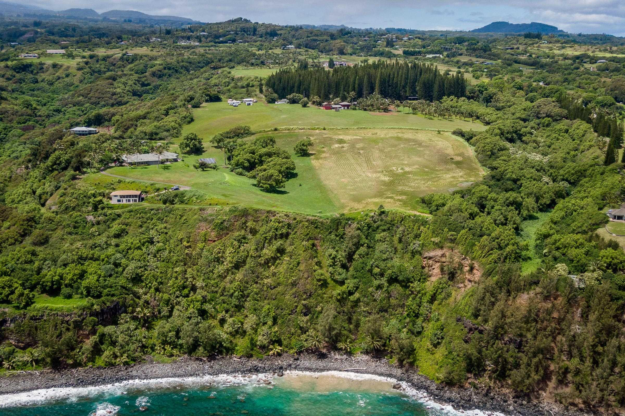 300 Mehana Road, Unit A Haiku, HI 96708 - Photo 8 of 21 a view of a town with mountains