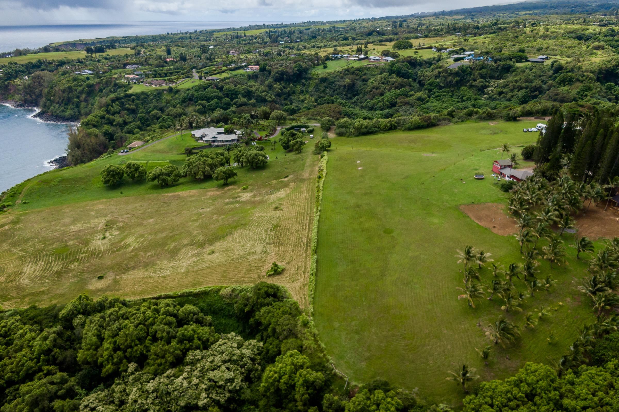 300 Mehana Road, Unit A Haiku, HI 96708 - Photo 9 of 21 a view of a lake with a yard