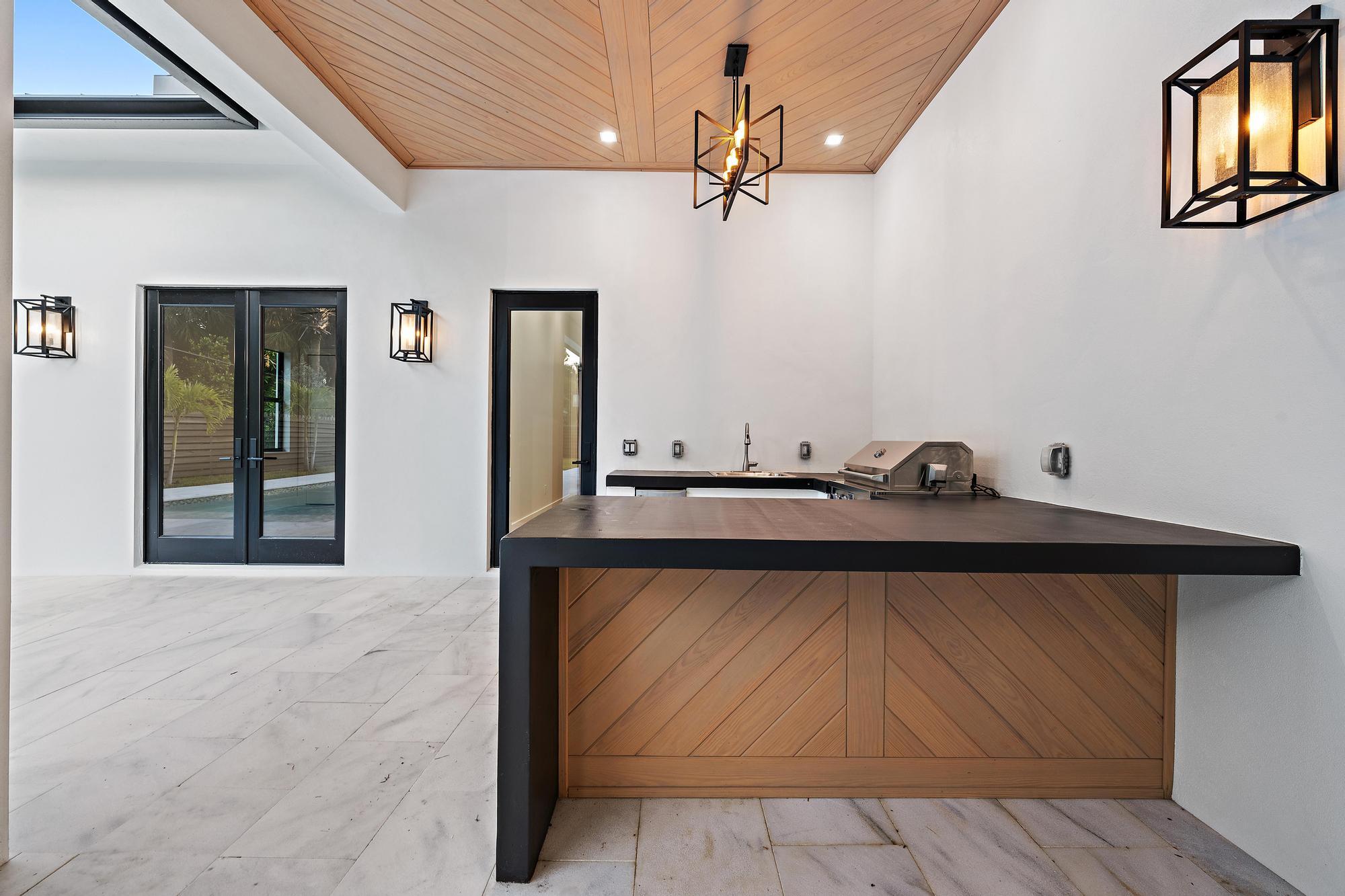 5701 Old Orange Road Jupiter, FL 33458 - Photo 23 of 51 a bathroom with a sink and a mirror