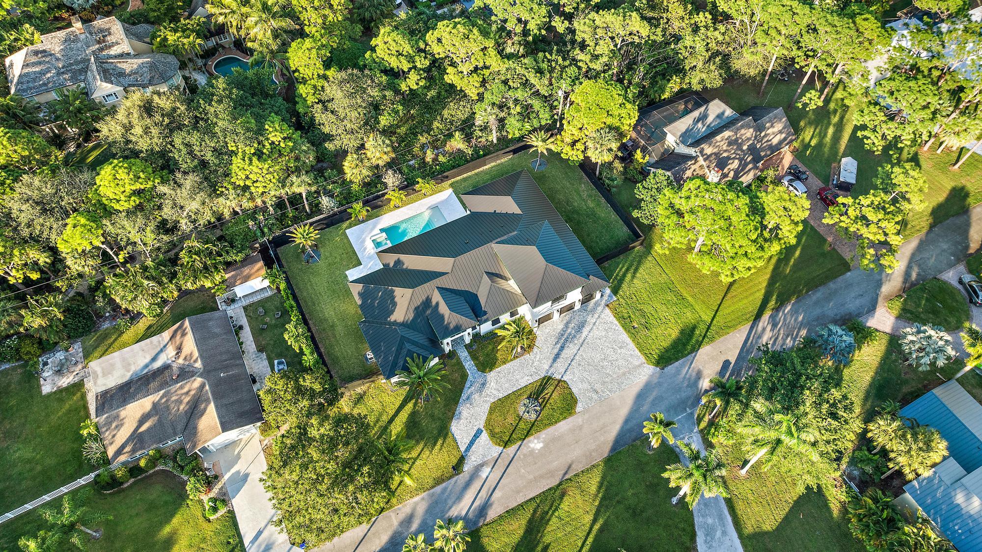 5701 Old Orange Road Jupiter, FL 33458 - Photo 43 of 51 an aerial view of a house