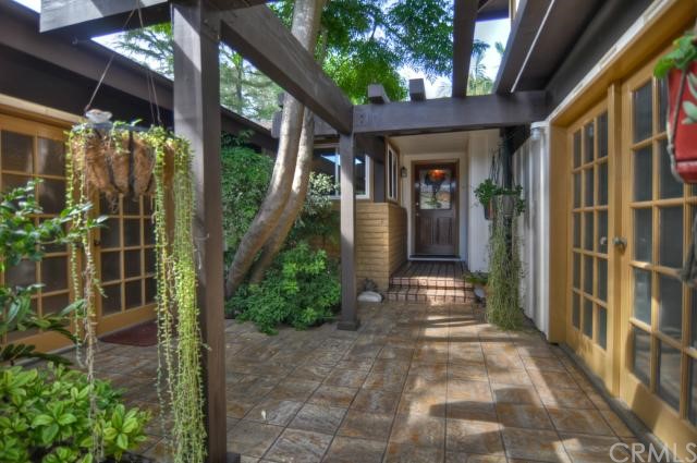 Lushly landscaped courtyard entry