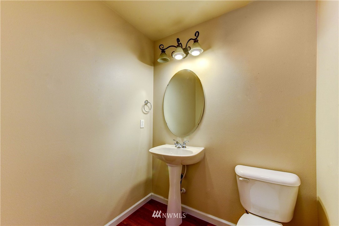 1716 235th Place Southwest Bothell, WA 98021 - Photo 11 of 25 a bathroom with a toilet sink and mirror
