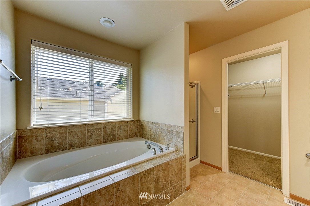 1716 235th Place Southwest Bothell, WA 98021 - Photo 17 of 25 a bathroom with a bathtub and shower