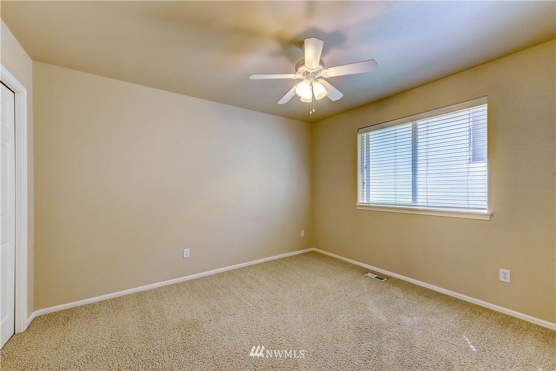 1716 235th Place Southwest Bothell, WA 98021 - Photo 18 of 25 an empty room with a window