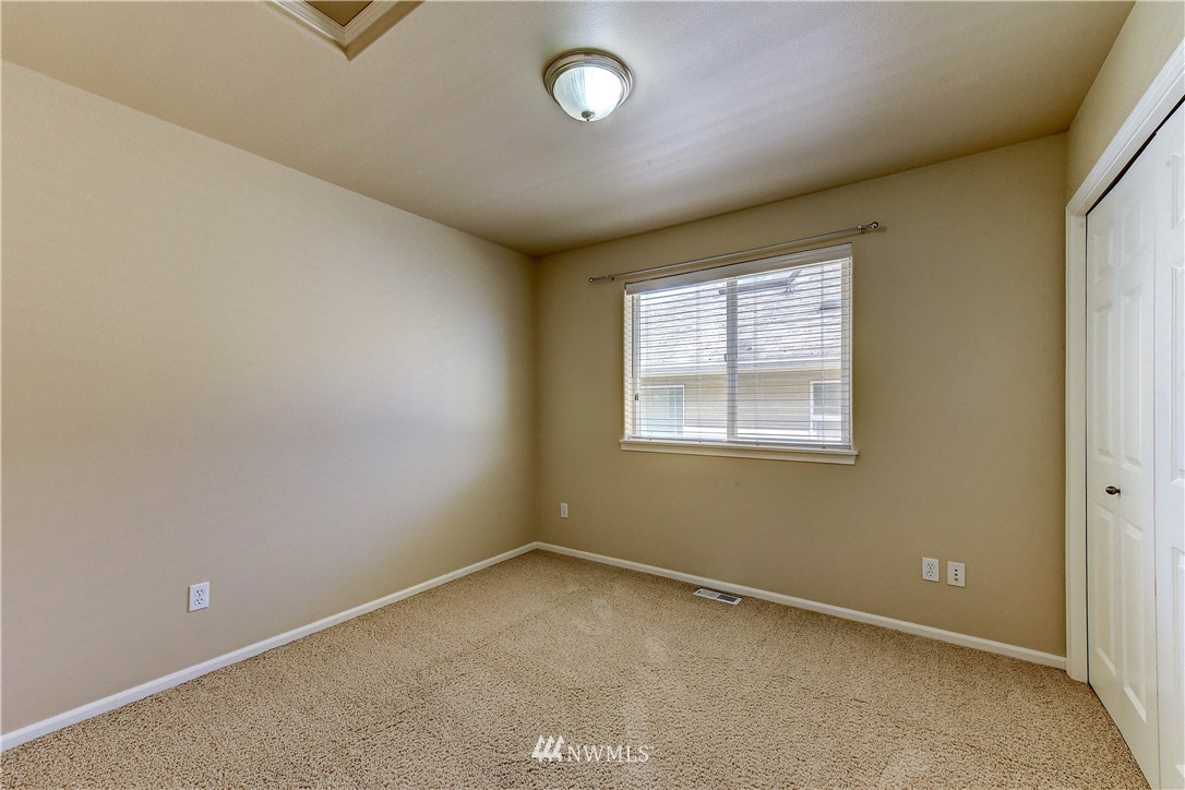 1716 235th Place Southwest Bothell, WA 98021 - Photo 21 of 25 an empty room with a window