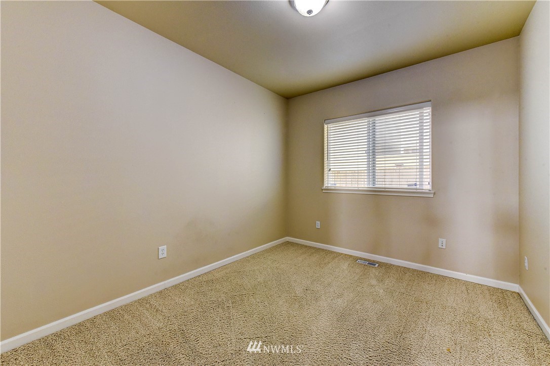1716 235th Place Southwest Bothell, WA 98021 - Photo 22 of 25 an empty room with a window