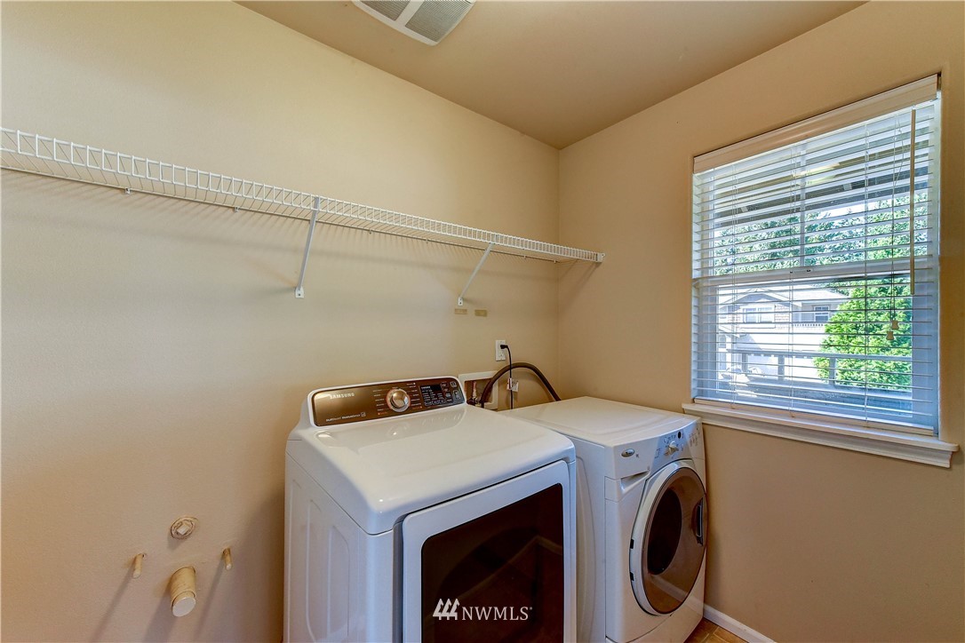 1716 235th Place Southwest Bothell, WA 98021 - Photo 23 of 25 a utility room with dryer and washer