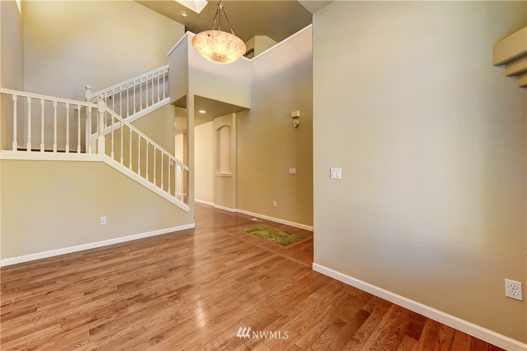 1716 235th Place Southwest Bothell, WA 98021 - Photo 5 of 25 a view of an entryway with wooden floor