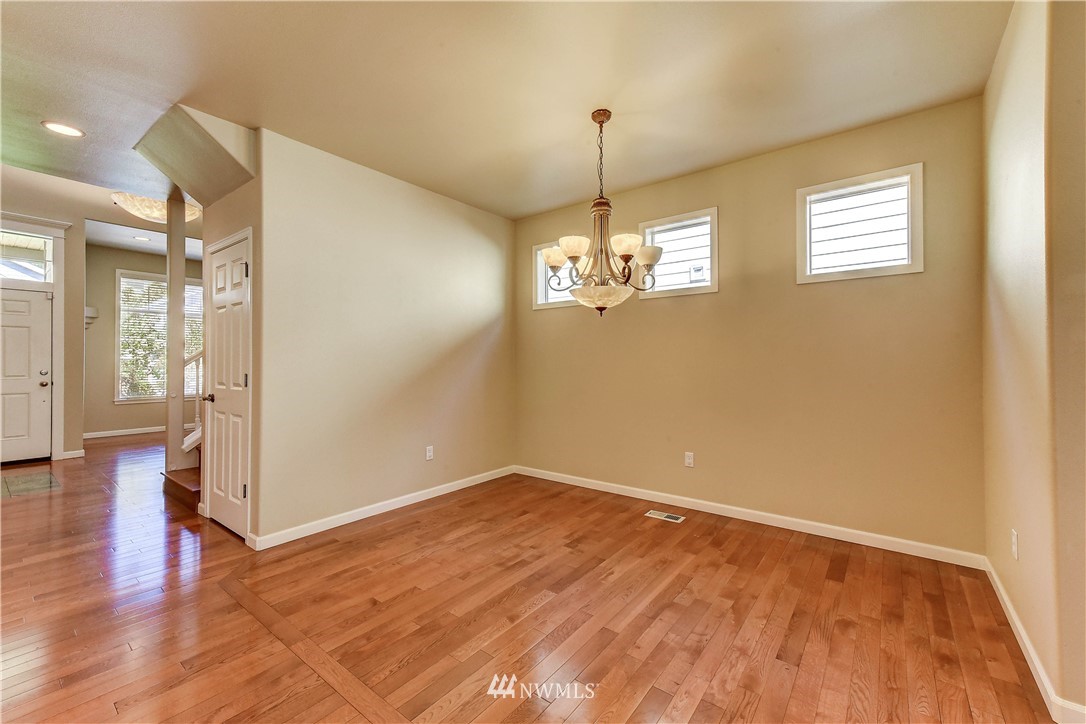 1716 235th Place Southwest Bothell, WA 98021 - Photo 6 of 25 a view of empty room with wooden floor