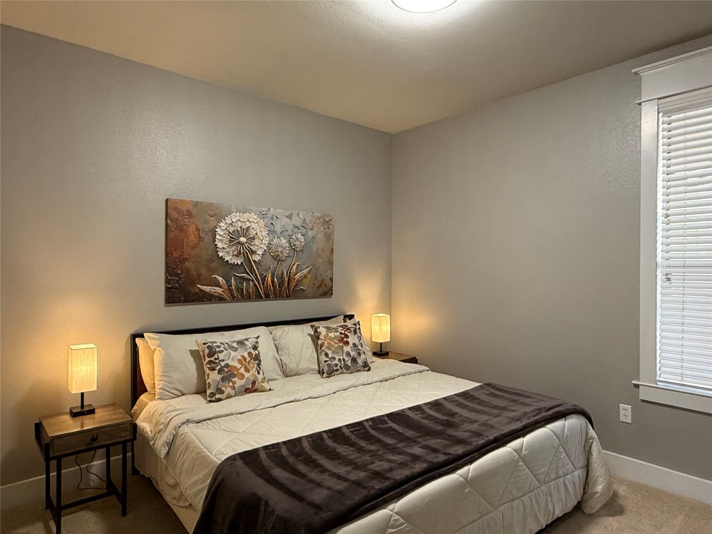 17808 Maritime Point, Unit 301 Jonestown, TX 78645 - Photo 17 of 40 a bedroom with a bed and a window