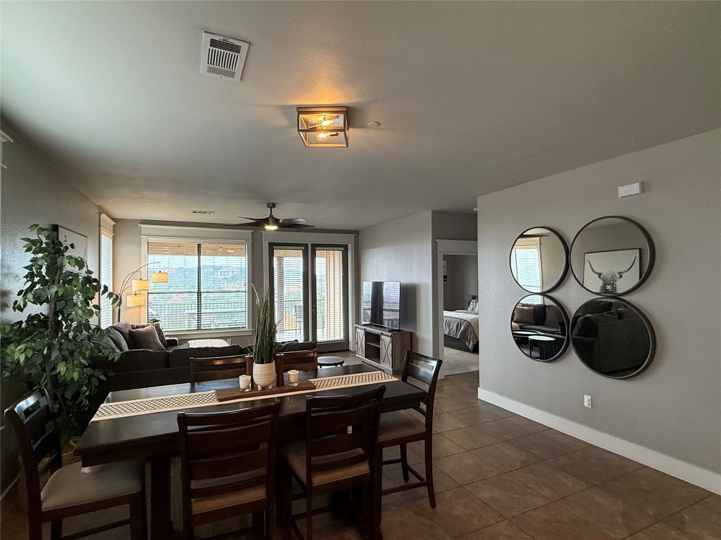 17808 Maritime Point, Unit 301 Jonestown, TX 78645 - Photo 25 of 40 a view of a dining room with furniture window and outside view
