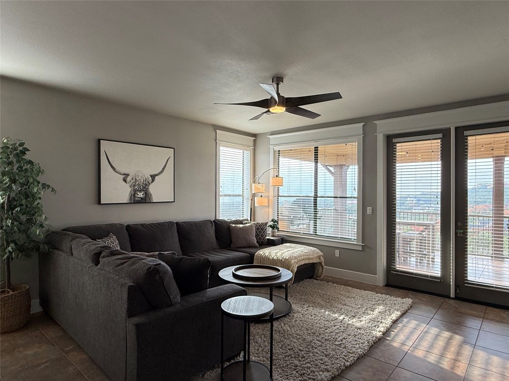 17808 Maritime Point, Unit 301 Jonestown, TX 78645 - Photo 26 of 40 a living room with furniture and a large window