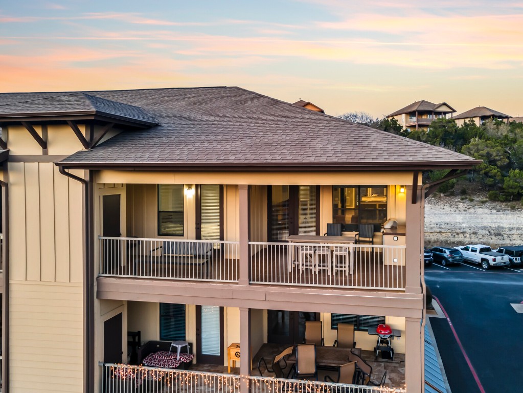 17808 Maritime Point, Unit 301 Jonestown, TX 78645 - Photo 32 of 40 a front view of a house with a porch