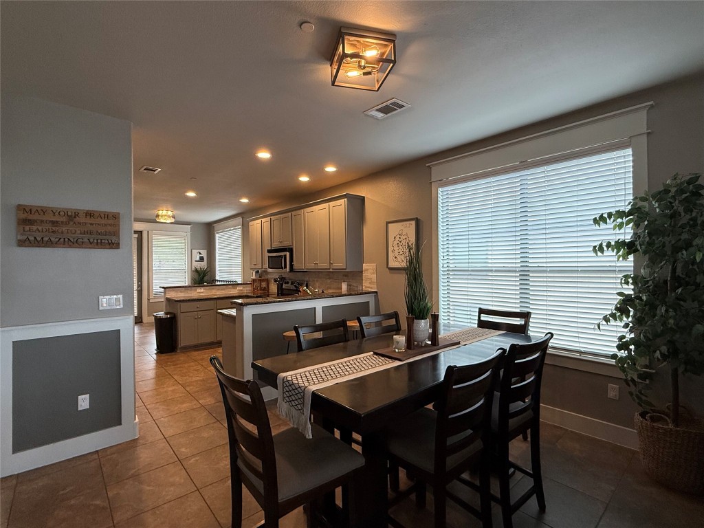 17808 Maritime Point, Unit 301 Jonestown, TX 78645 - Photo 8 of 40 Dining area featuring recessed lighting and dark tile patterned floors