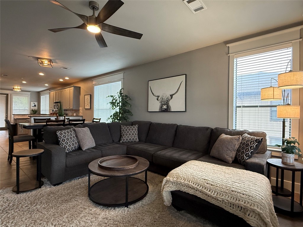 17808 Maritime Point, Unit 301 Jonestown, TX 78645 - Photo 10 of 40 Living room featuring a ceiling fan
