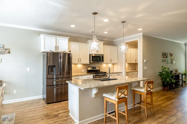 a bathroom with a double vanity sink mirror and shower