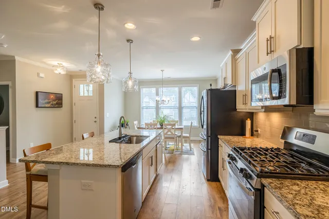 a bed room with a bed and a chair