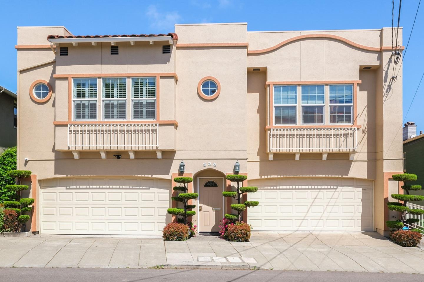 551 Merritt Avenue, Unit 1 Oakland, CA 94610 - Photo 1 of 20 a front view of a building with many windows