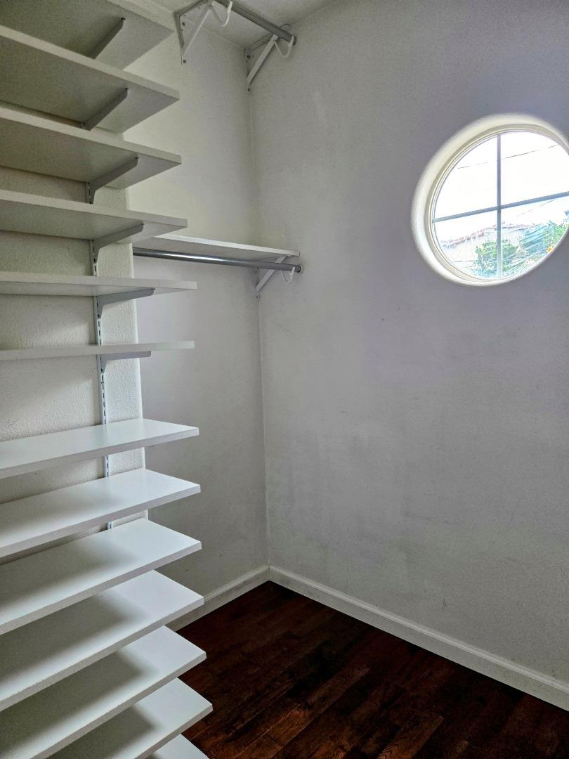 551 Merritt Avenue, Unit 1 Oakland, CA 94610 - Photo 15 of 20 a view of a room with racks on the wall