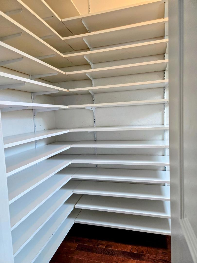 551 Merritt Avenue, Unit 1 Oakland, CA 94610 - Photo 16 of 20 a view of walk in closet with empty racks