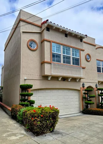a front view of a house with many windows