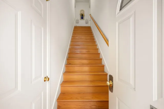 a view of staircase with white walls
