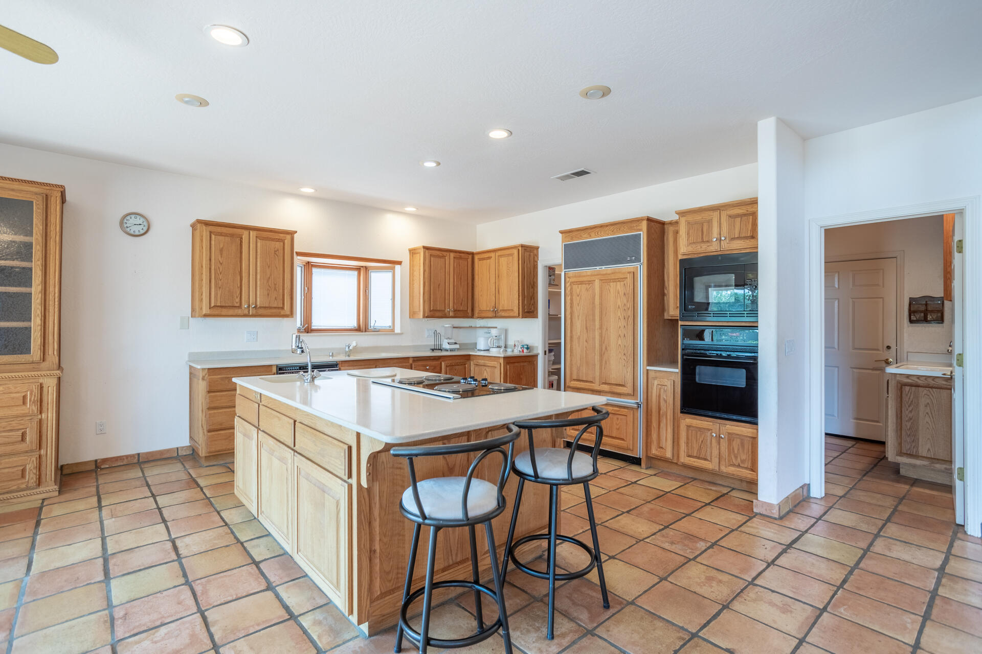 15560 China Rapids Drive Red Bluff, CA 96080 - Photo 19 of 43 a kitchen with granite countertop a sink cabinets and stainless steel appliances