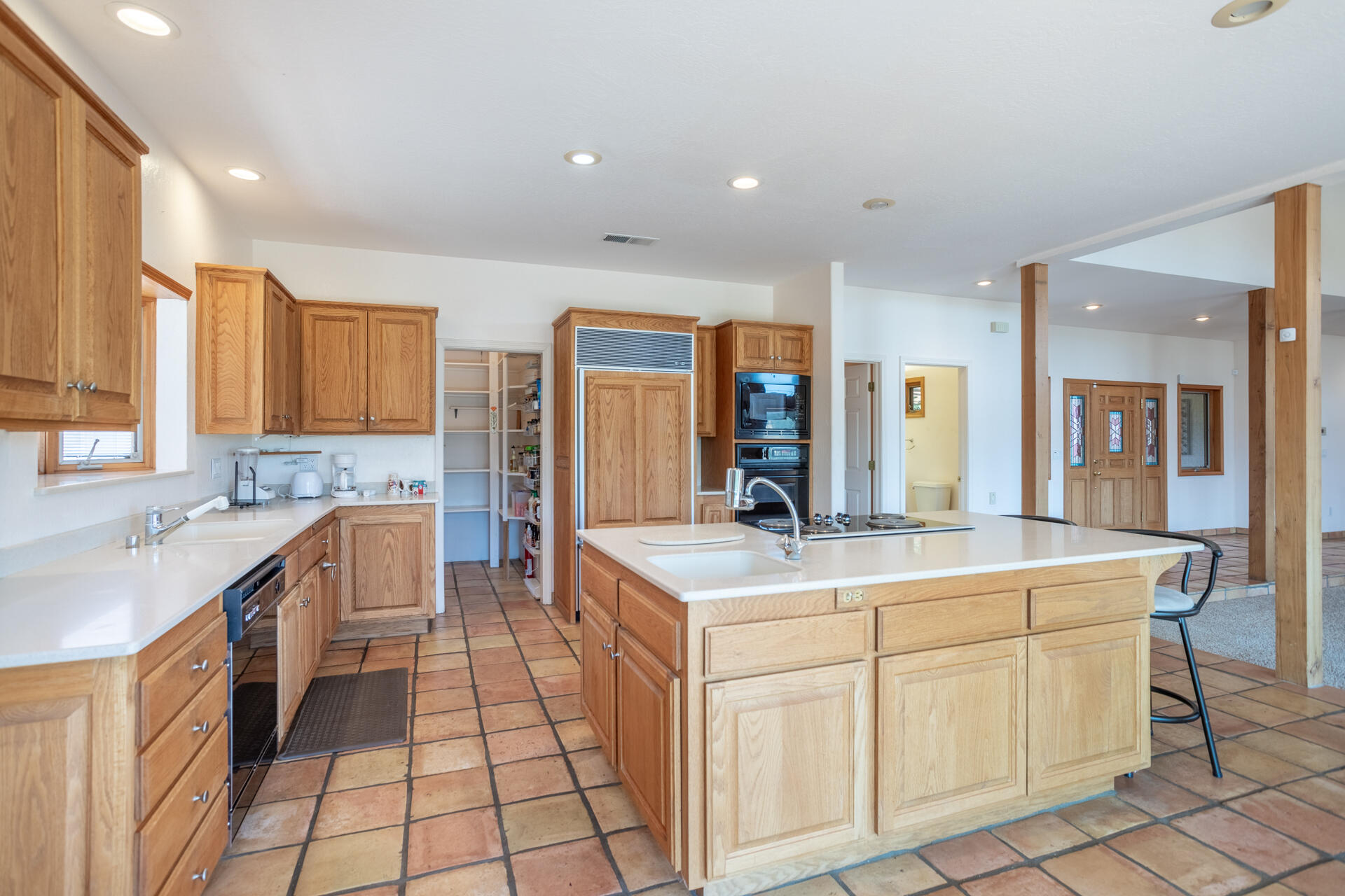 15560 China Rapids Drive Red Bluff, CA 96080 - Photo 22 of 43 a kitchen with a sink stove and cabinets