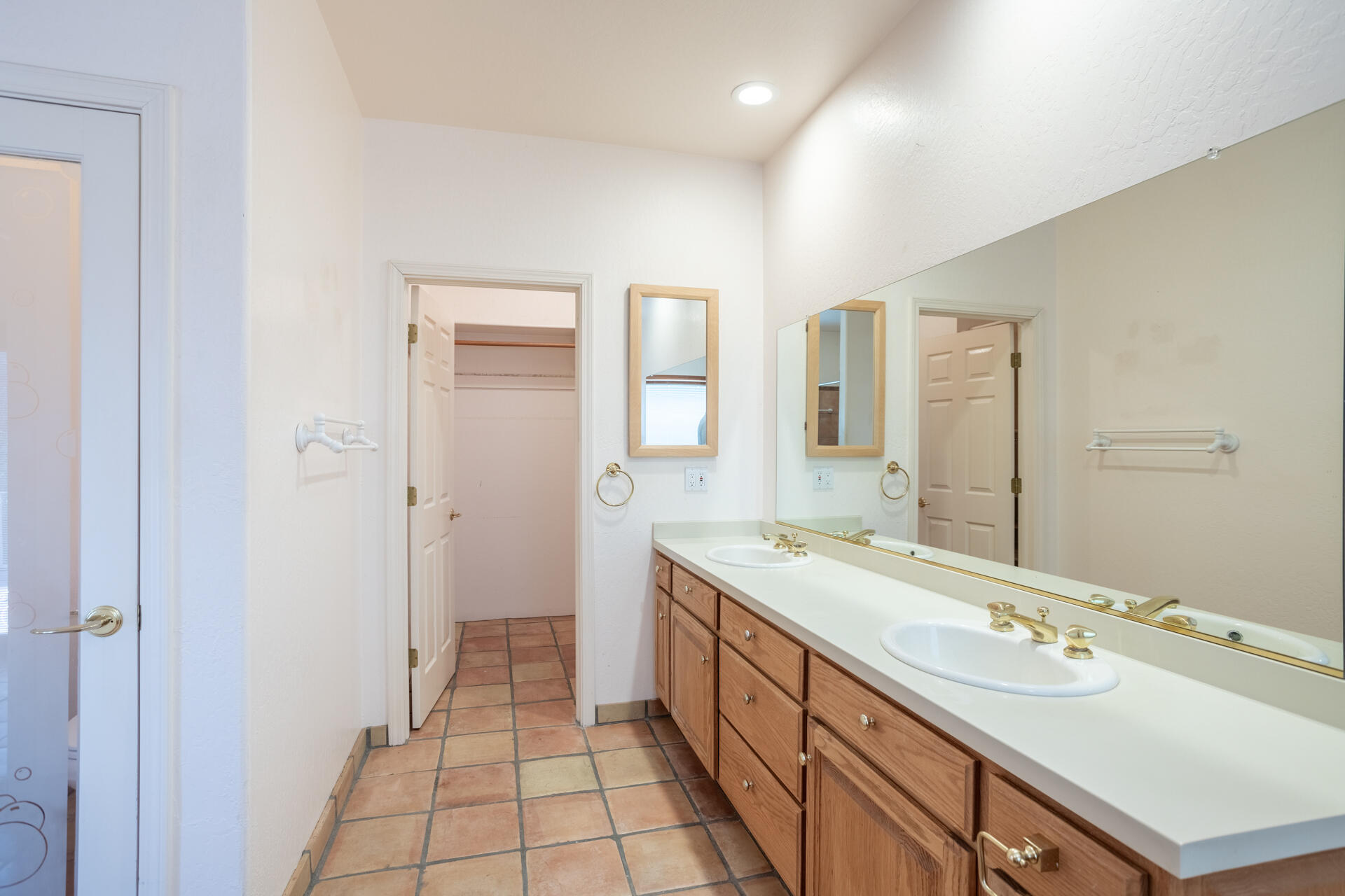15560 China Rapids Drive Red Bluff, CA 96080 - Photo 32 of 43 a spacious bathroom with a double vanity sink a mirror and a
